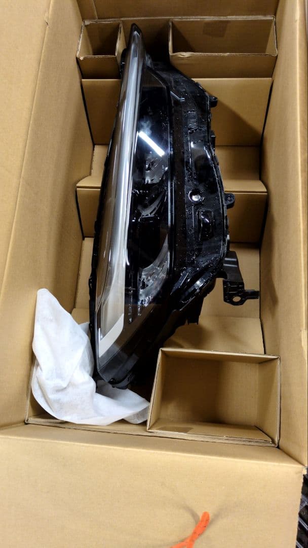 ベゼルヘッドランプassy右