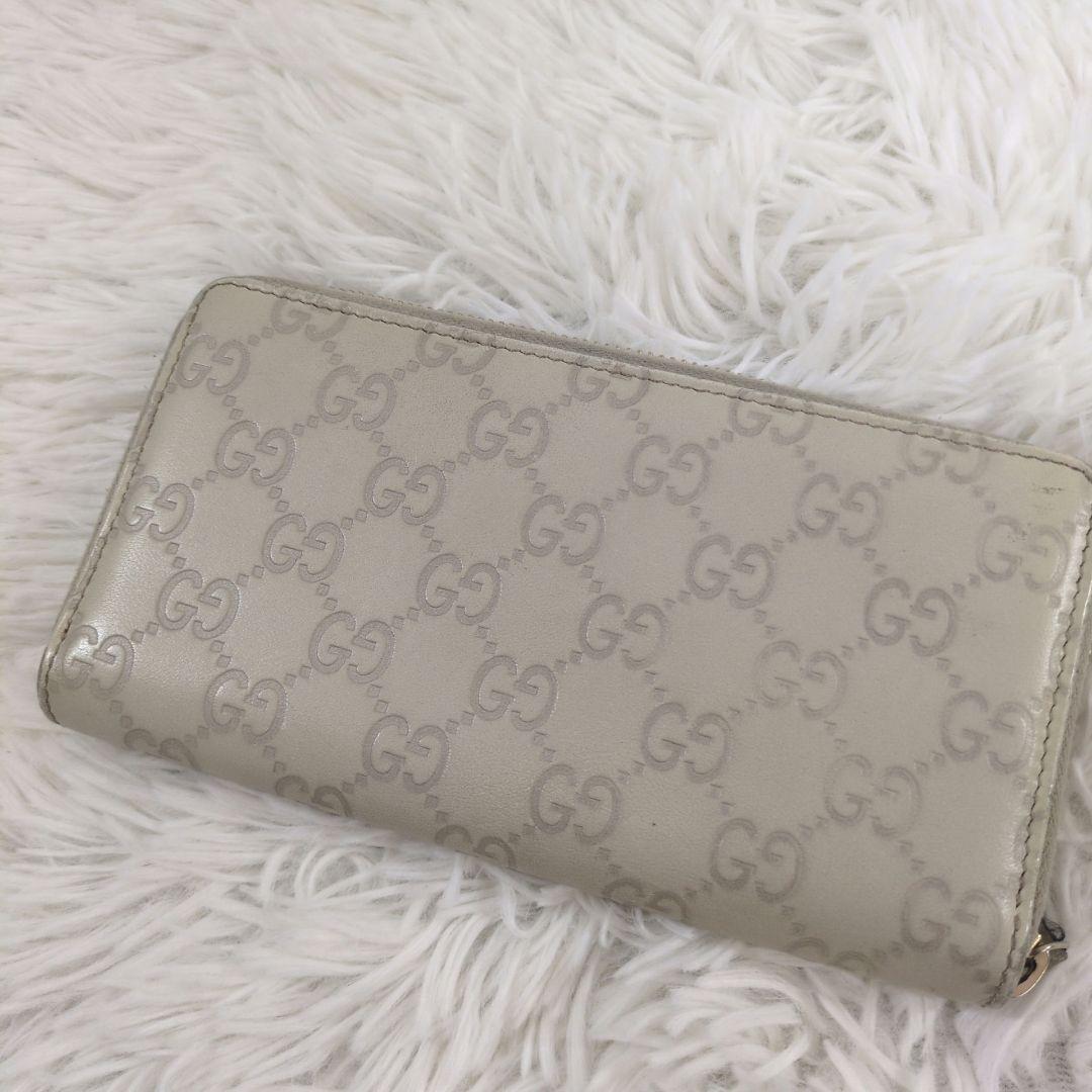 GUCCI 長財布 ラウンドジップ シマ 金プレート 型押し レザー ホワイト