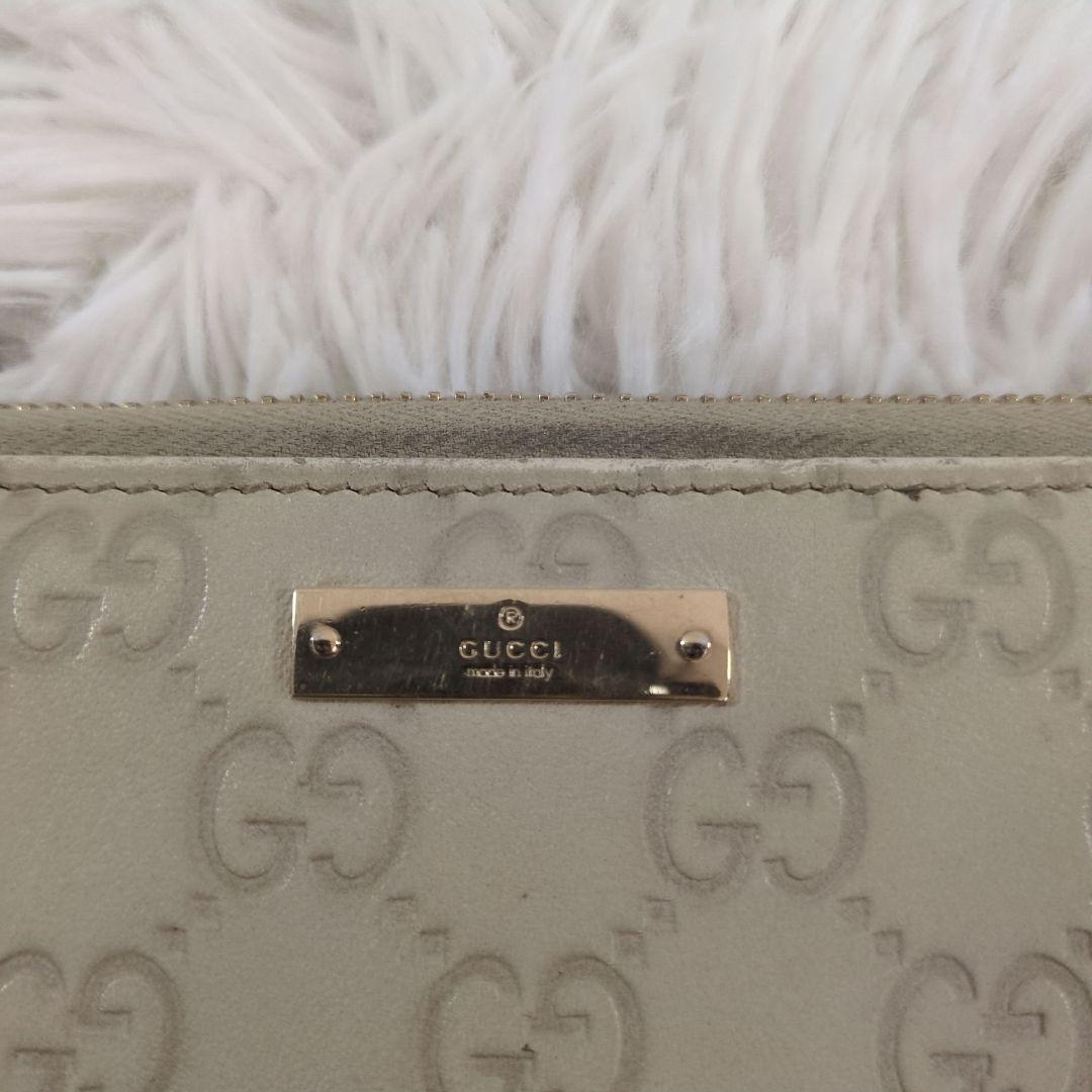 GUCCI 長財布 ラウンドジップ シマ 金プレート 型押し レザー ホワイト