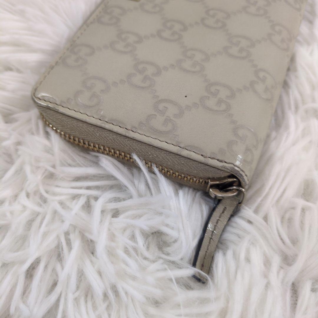 GUCCI 長財布 ラウンドジップ シマ 金プレート 型押し レザー ホワイト