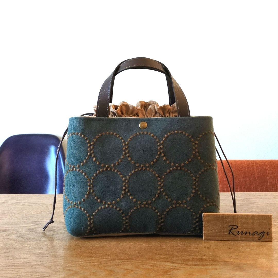 あおりポケットの巾着バッグ＊ミナペルホネン