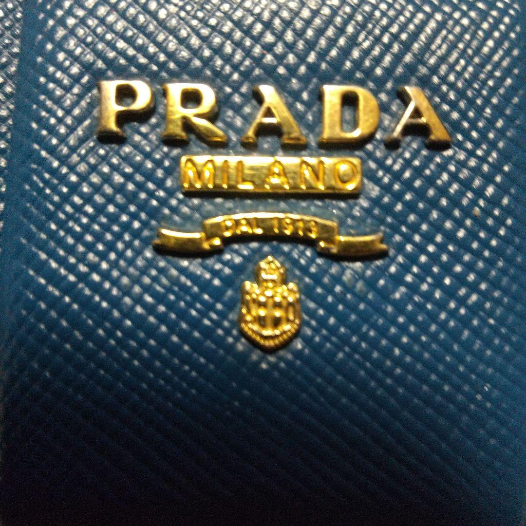 PRADAサフィアーノラウンドファスナー リボン付き長財布