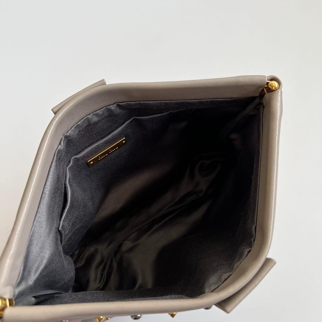 バッグ MIU MIU LEATHER STUDS FRAME CLUTCH BAG