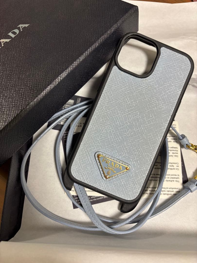 PRADA ストラップ付きiPhone15ケース ライトブルー