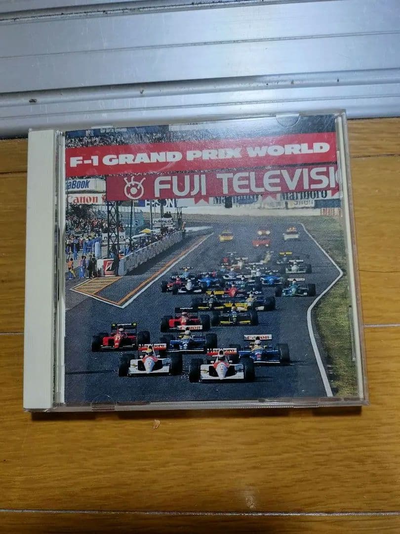 アイルトン・セナ サイン入り写真とF1カーとセナ愛用ヘルメットとCDの5点セット