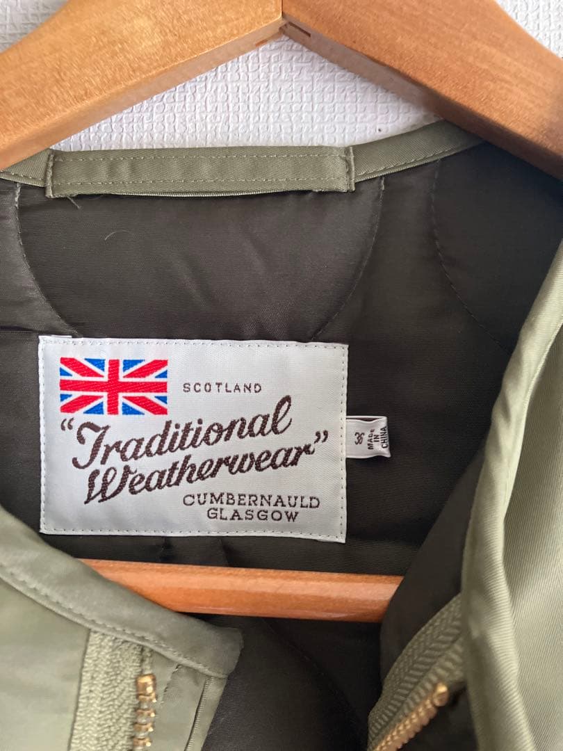 M*O様 トラドィショナルウェザーウェアノーカラーロングジャケット カーキ36サ