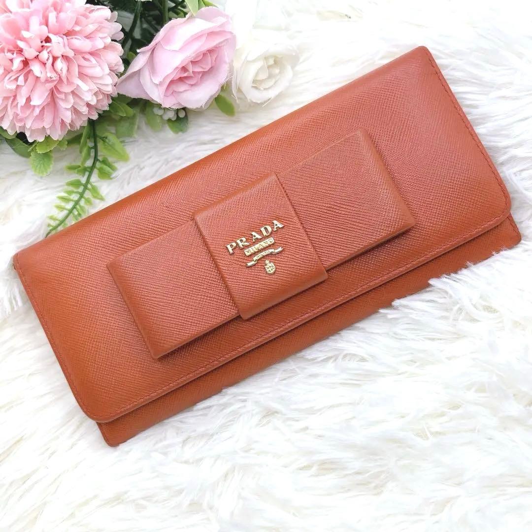 プラダ 長財布 サフィアーノ フィオッコ レッド メタルロゴ リボン