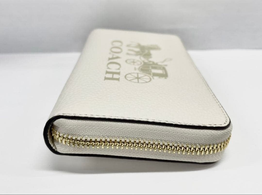 コーチ 長財布 レディース レザー ストラップ付き 馬車モチーフ オフホワイト系