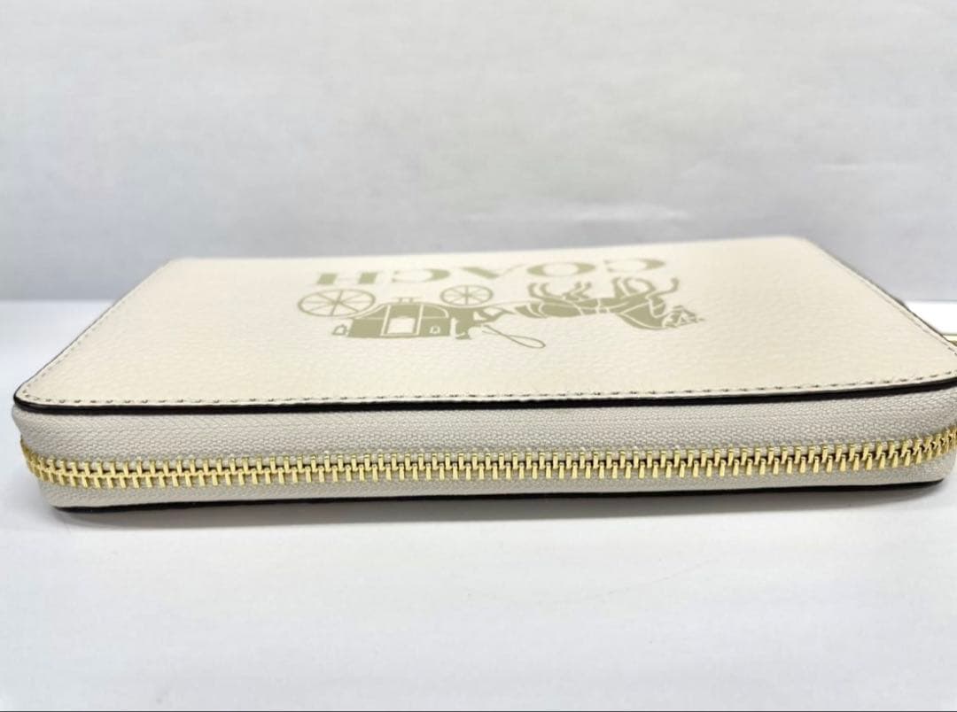 コーチ 長財布 レディース レザー ストラップ付き 馬車モチーフ オフホワイト系