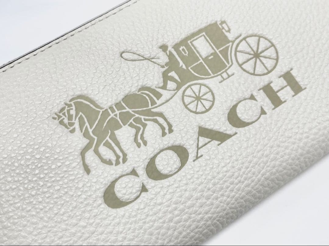 コーチ 長財布 レディース レザー ストラップ付き 馬車モチーフ オフホワイト系