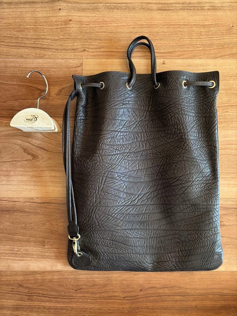 極美品 Cisei シセイ ドローストリングバッグ レザー 巾着 吊しハンガー付