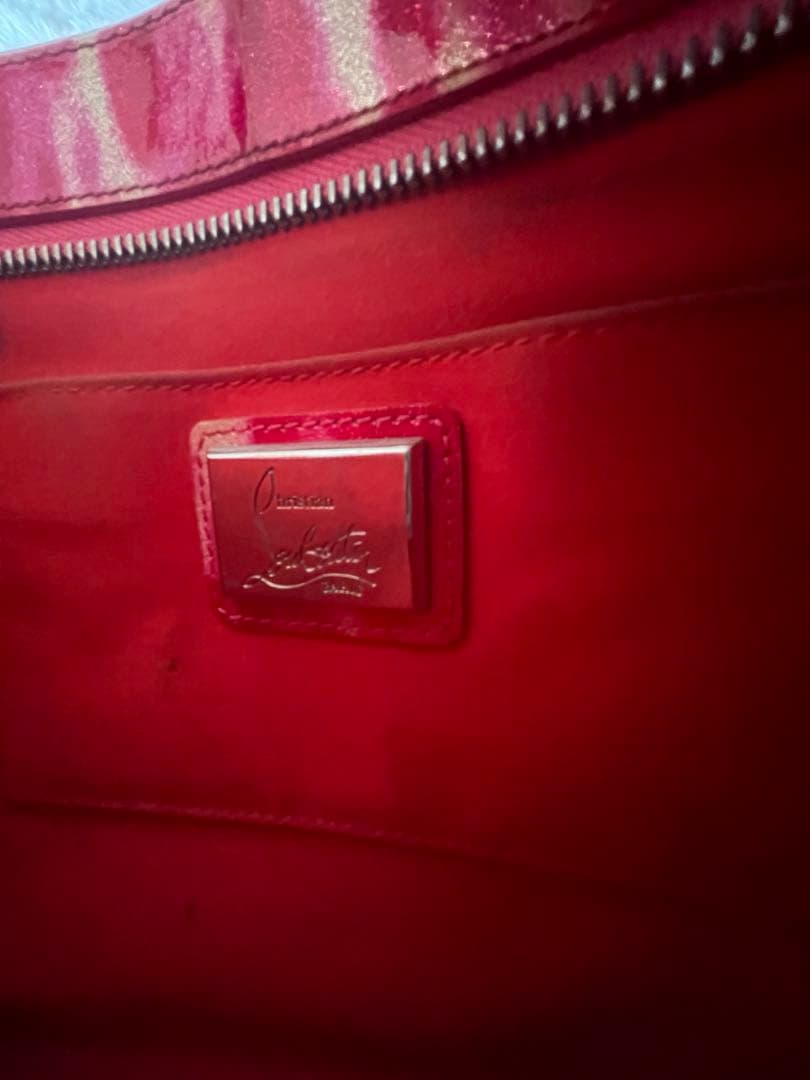 クリスチャンルブタン　スタッズ付きピンククラッチバッグ