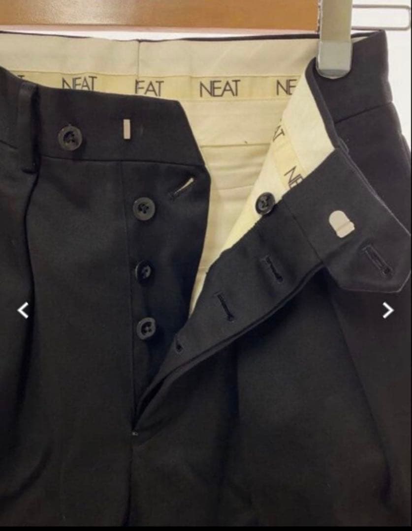 NEAT ブラック テーパードスラックス