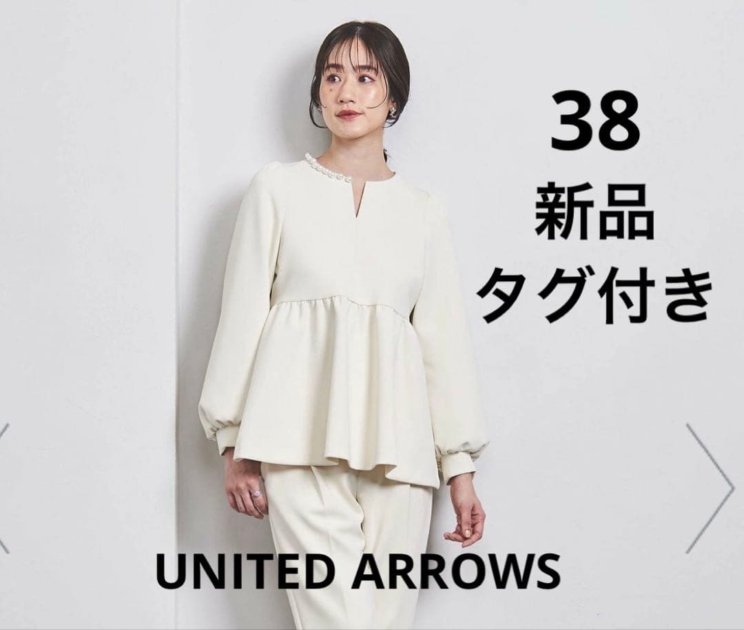 新品タグ付き　パールモチーフペプラムヴラウス