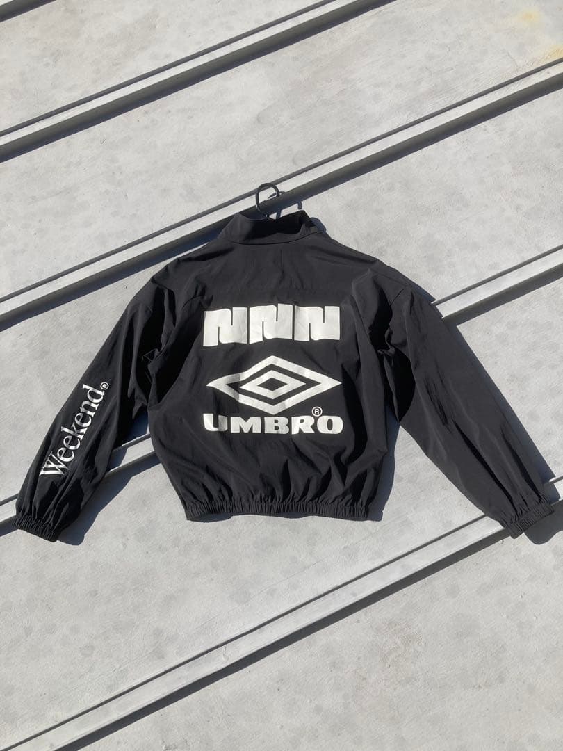 NBB WEEKEND × UMBROハーフジップ ピステ ジャケット