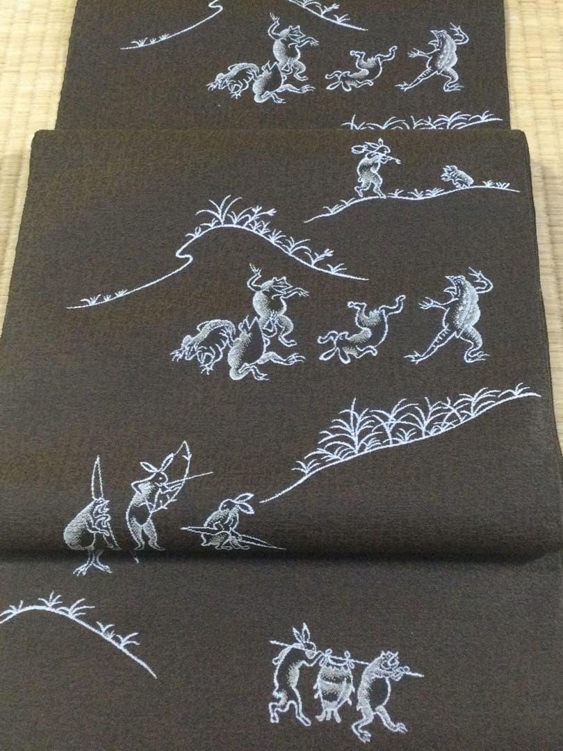 素敵な装い！西陣名古屋帯 綿芯仕立付 「鳥獣人物戯画」茶　簡易包装