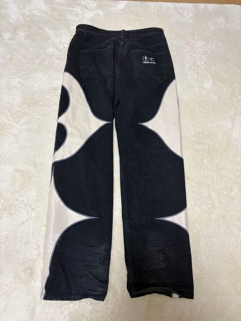 THUG CLUB グラフィックデニムパンツ