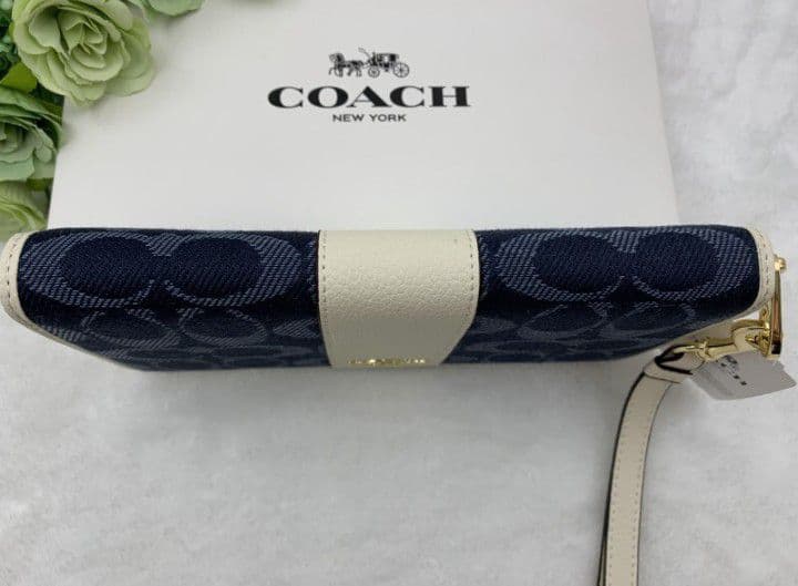新品未使用コーチ長財布ネイビーホワイトシグネチャーレディースメンズ送料無料
