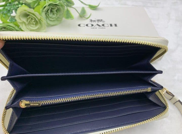 新品未使用コーチ長財布ネイビーホワイトシグネチャーレディースメンズ送料無料