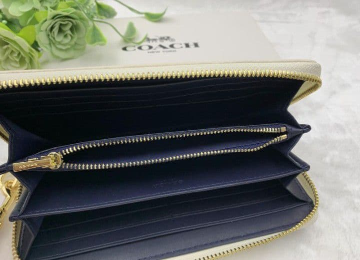 新品未使用コーチ長財布ネイビーホワイトシグネチャーレディースメンズ送料無料