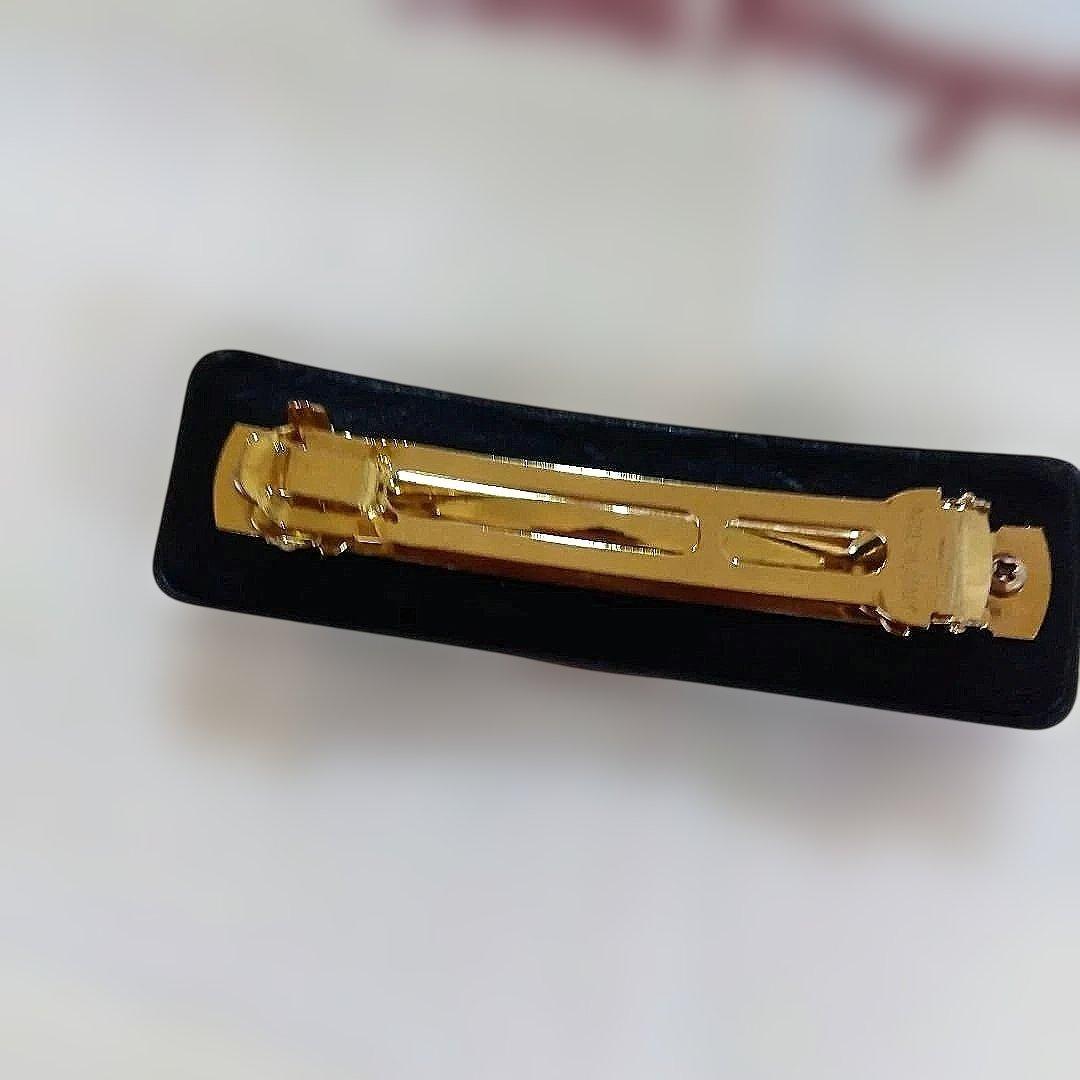 サルバトーレ・フェラガモ　 リボン型ヘアクリップ 黒金