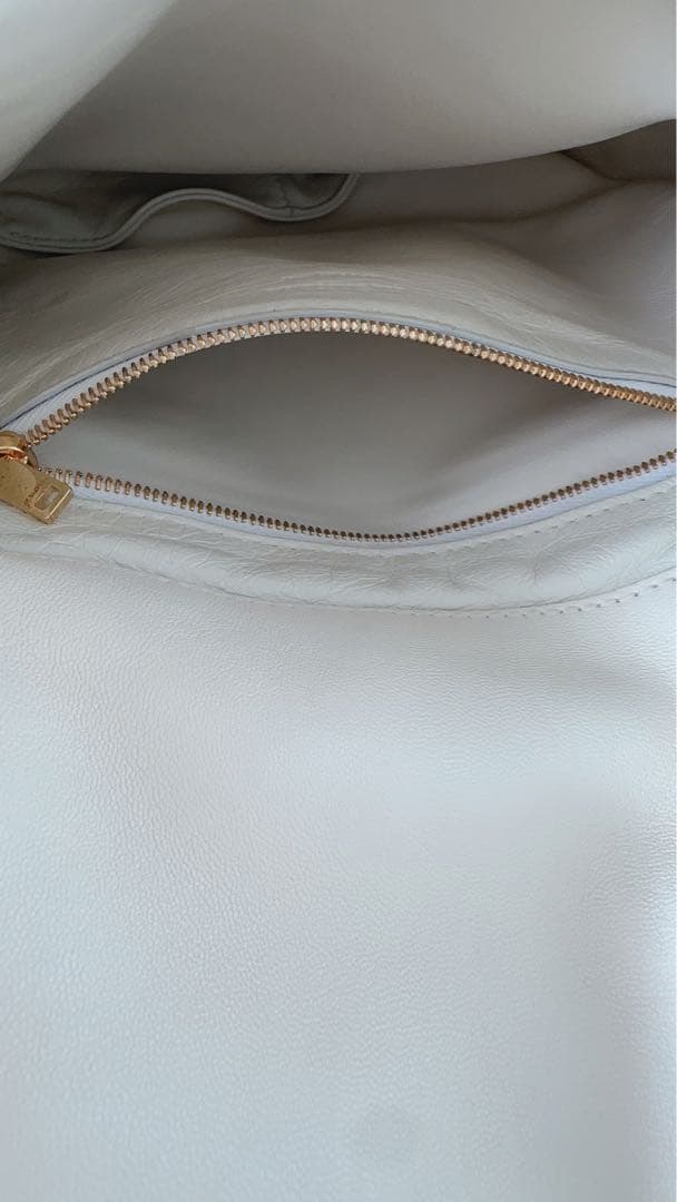 Jil Sander（ジル・サンダー）のホワイトクラッチバッグ /エッグシェル