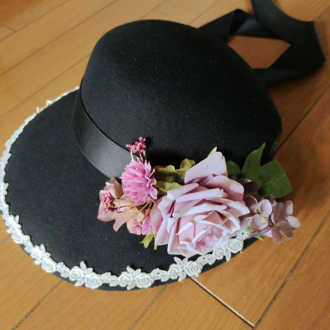イノセントワールド　黒い花飾り付き広つばハット