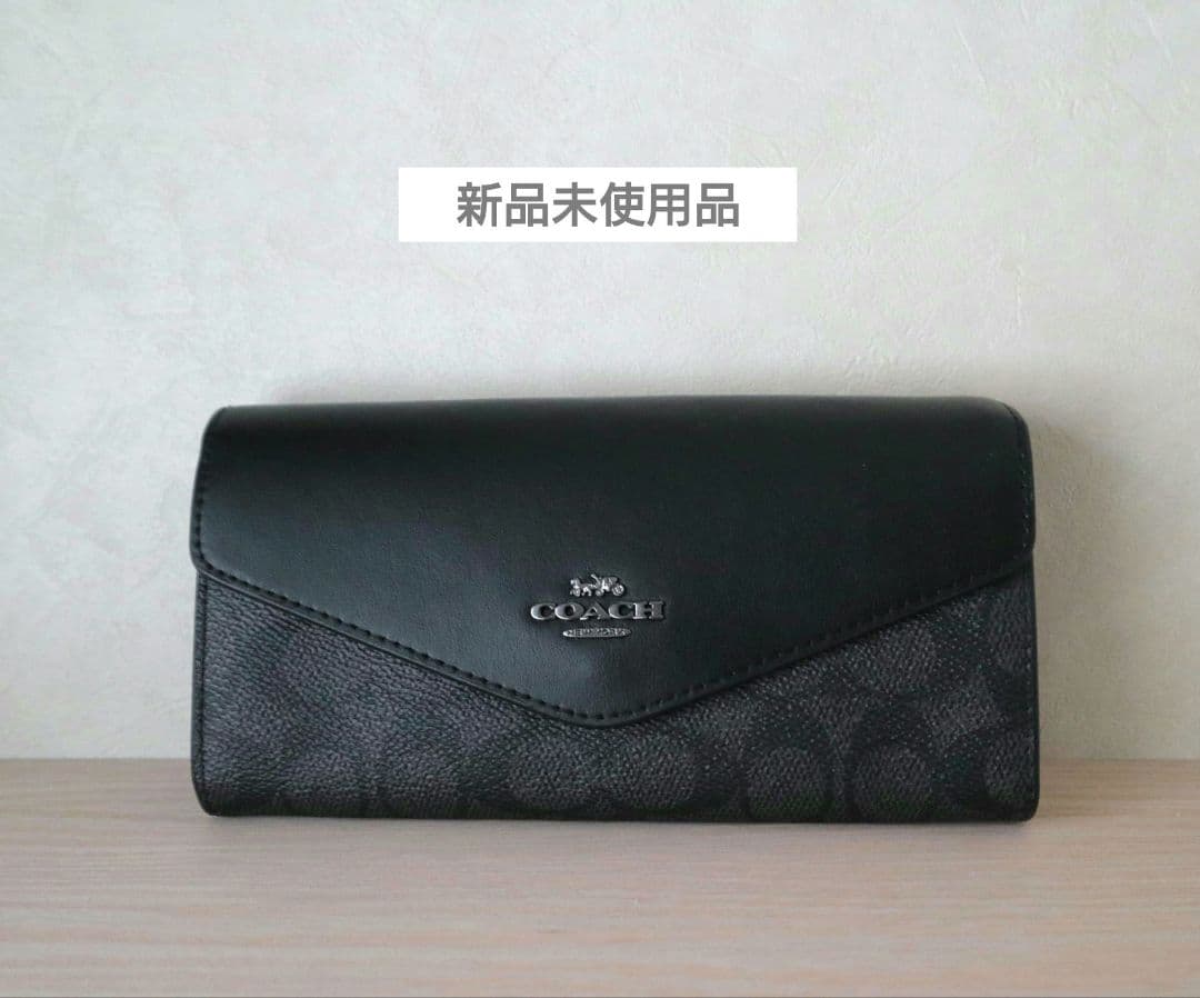 新品コーチ COACH 長財布　エンベロープ ウォレットシグネチャー キャンバス