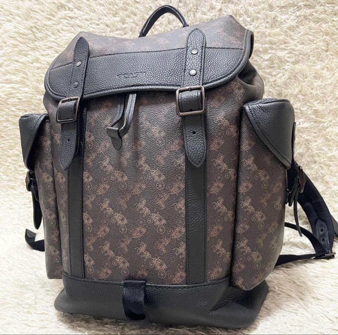 【美品/A4可】COACH 巾着　リュック　レザー　PVC　黒　馬車柄　ロゴ金具