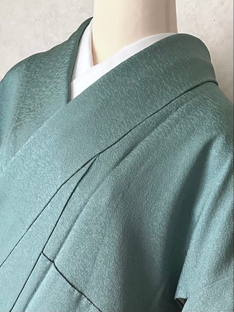 a09【在庫処分・特価】未使用 青緑 織柄 正絹 色無地 裄 64.5